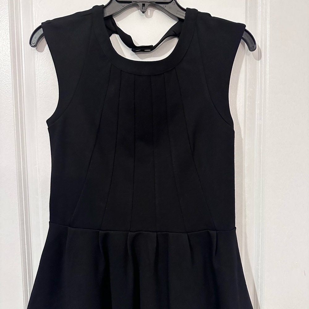 H&M black peplum top with back out